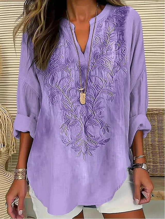 Blouse décontractée élégante Nina de Danoir Paris avec rayures bleues, tissu léger et coupe moderne visible sur l'image.
