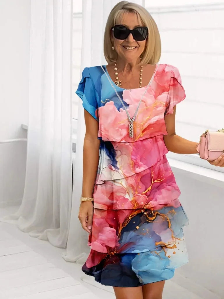 Robe fluide élégante Adèle de Danoir Paris avec volants, couleur rose, portée élégante et féminine.