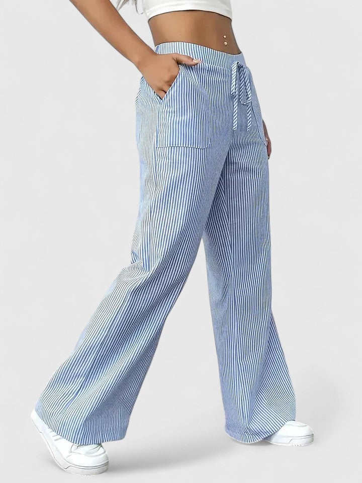 Pantalon large élégant Dominique de Danoir Paris en tissu rose, vue de face avec ceinture ajustable.