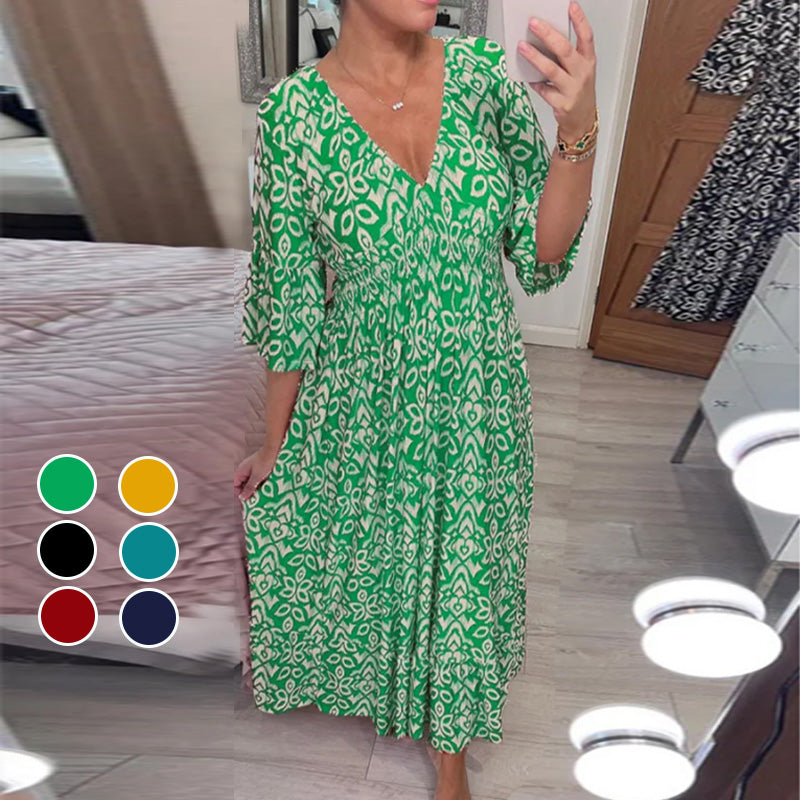 Robe évasée rouge Danoir Paris Mhara, élégante, en tissu fluide, portée avec manches longues et coupe flatteuse.