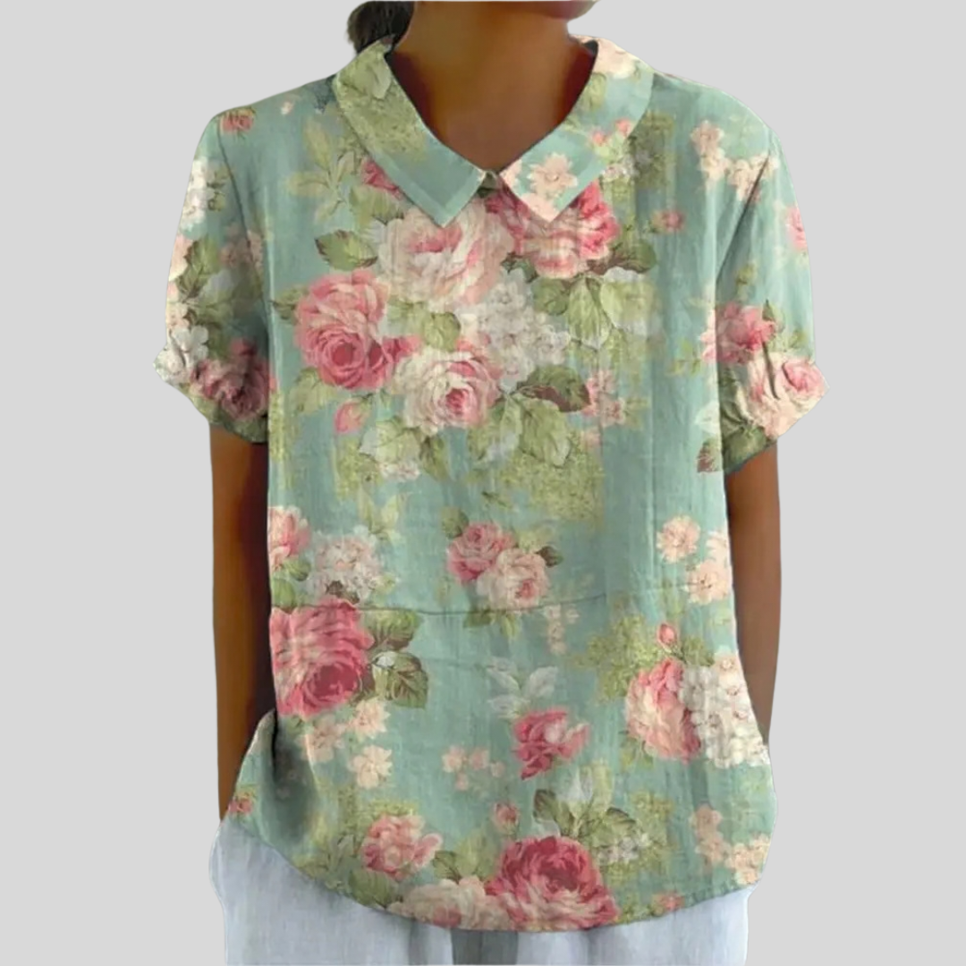 Blouse florale vintage Brigitte de Danoir Paris, motif coloré, en tissu léger, portée décontractée, style rétro.