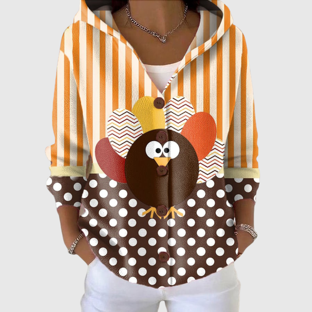 Cardigan Danoir Paris à capuche en maille douce, confort et style, porté avec manches longues et fermeture à boutons.