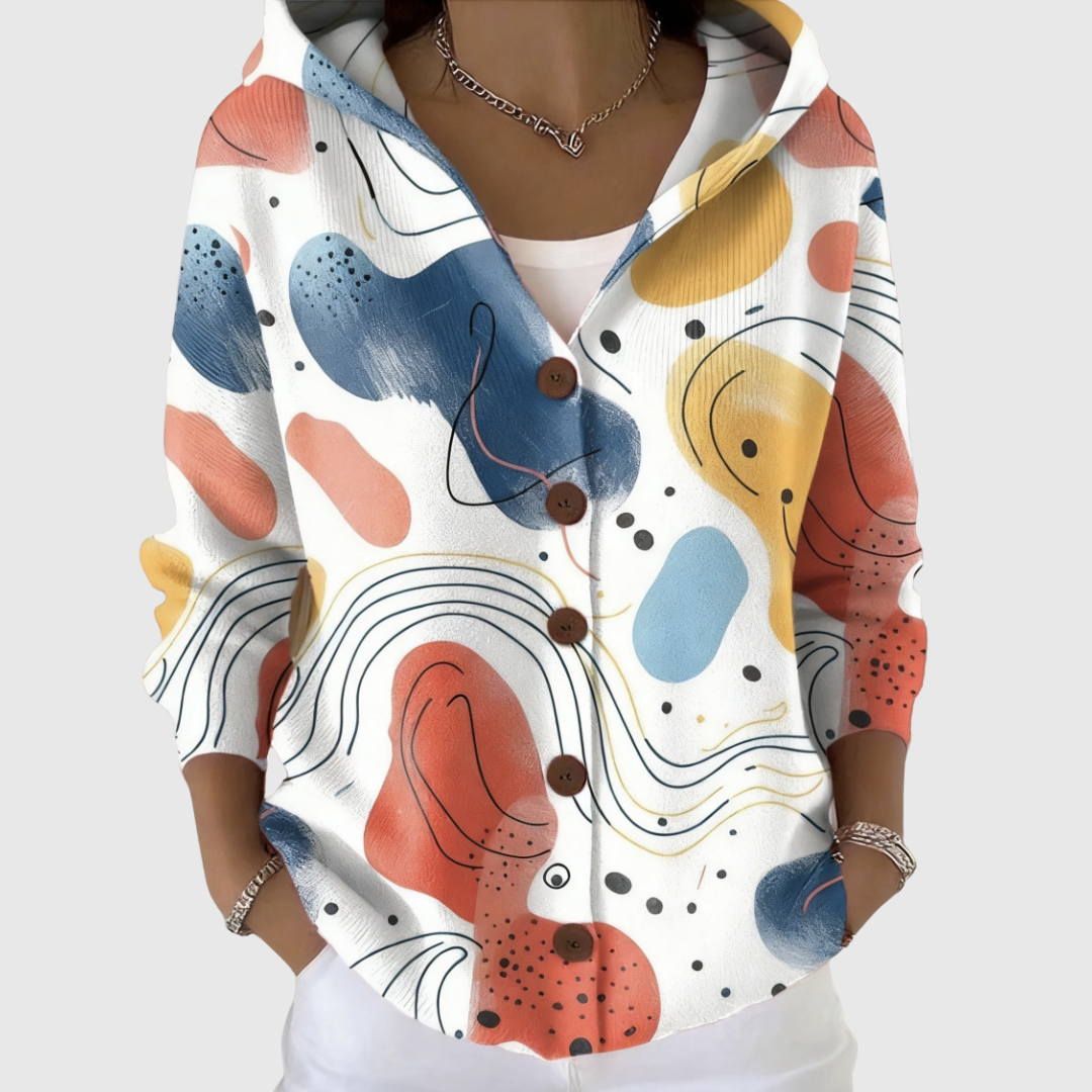 Cardigan Danoir Paris à capuche en maille douce, confortable et chaud, porté avec manches longues et fermeture devant.