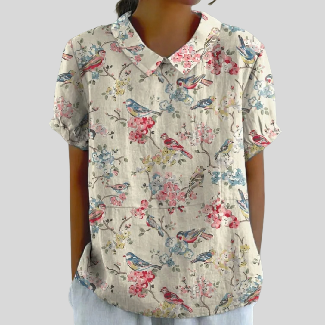 Blouse Clémence Danoir Paris avec imprimé oiseaux et fleurs, tissu léger et élégant, portée décontractée ou habillée.