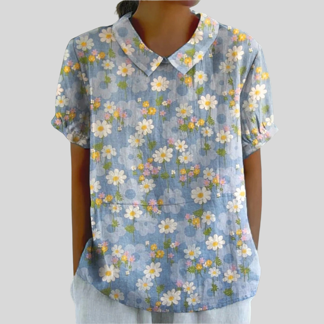 Blouse Coralie Danoir Paris avec motif marguerites fraîches, tissu léger et design élégant, vue de face.