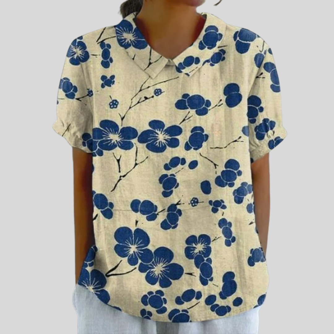 Blouse florale contrastée Delphine de Danoir Paris, tissu léger avec motifs colorés, manches longues et col en V élégants.