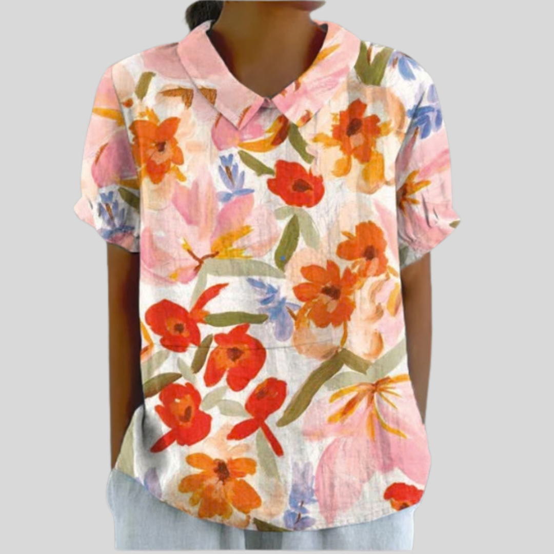Blouse florale expressive Danoir Paris Évelyne avec motifs colorés et détails élégants, vue de face.