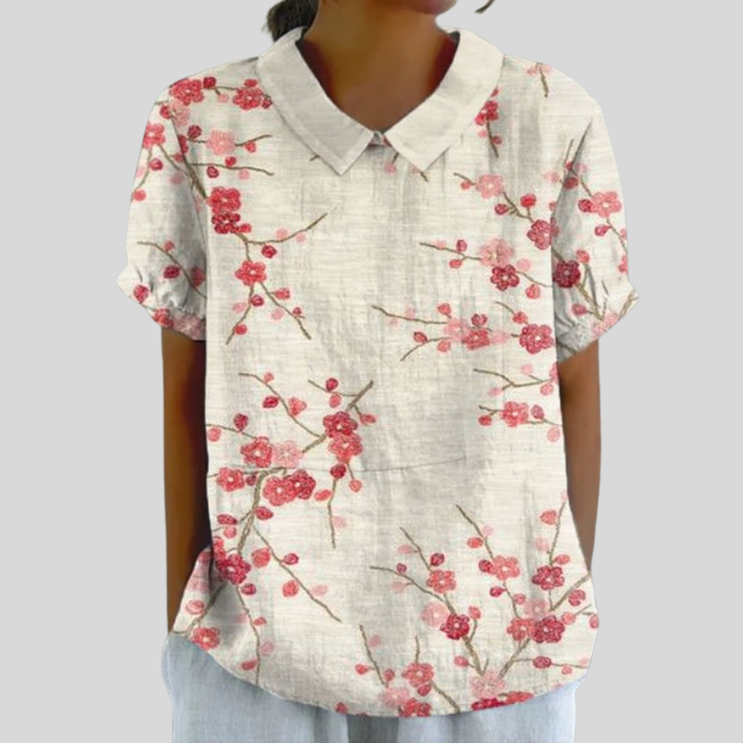 Blouse fleurie épurée Florence de Danoir Paris, tissu léger avec motif floral, manches longues et coupe élégante.