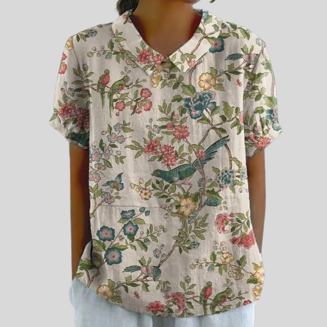 Blouse florale illustrée Joséphine de Danoir Paris, en tissu léger, avec motifs floraux colorés et coupe élégante.