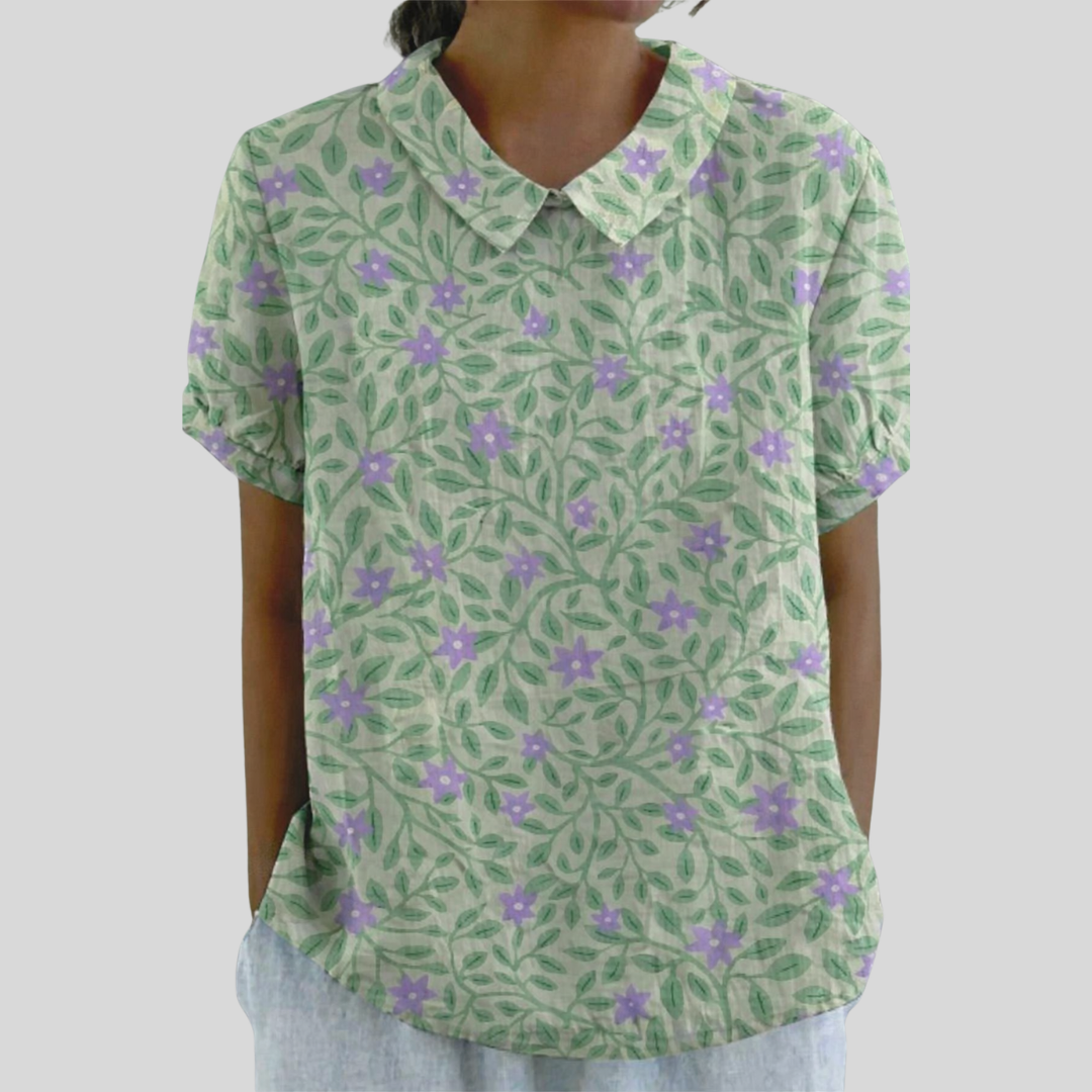 Blouse femme Lucienne Danoir Paris avec motif feuillage fleuri, tissu léger et élégant, portée sur mannequin.