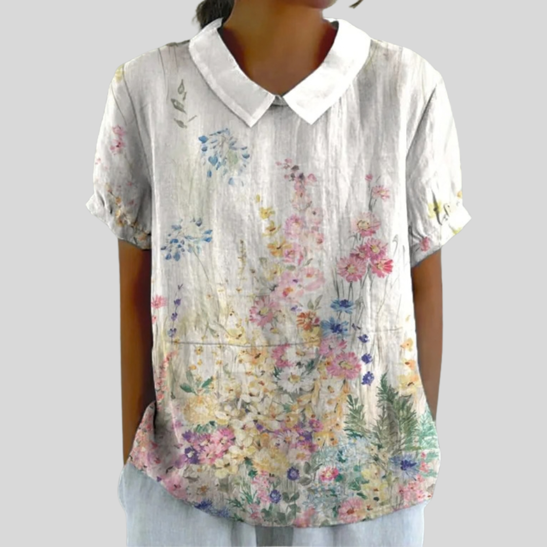 Blouse Lysiane de Danoir Paris avec motif floral jardin, manches longues, tissu léger, style élégant et féminin.