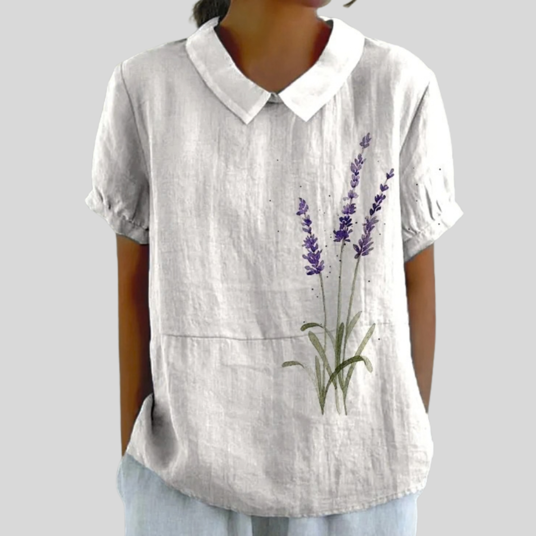 Blouse fleurie minimaliste Renée de Danoir Paris, légère et élégante, avec motif floral délicat sur tissu fluide.