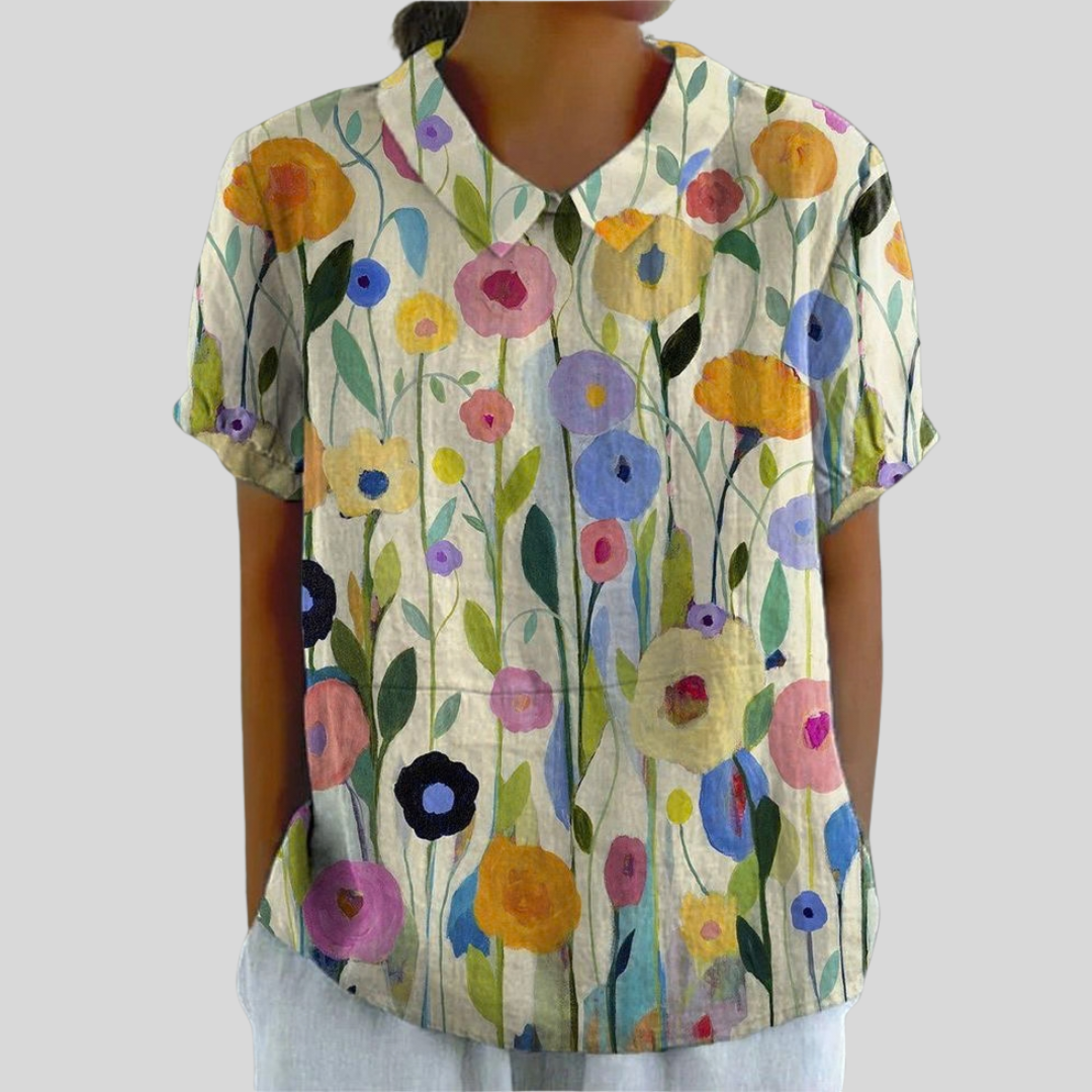 Blouse florale graphique Solène de Danoir Paris portée, avec motifs colorés et coupe élégante, vue de face.