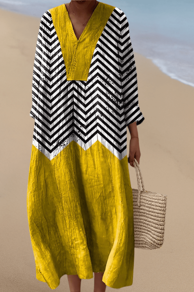 Robe Mélodie Tessa™ de Danoir Paris, en tissu fluide avec détails élégants, portée d'une femme dans un style sophistiqué.