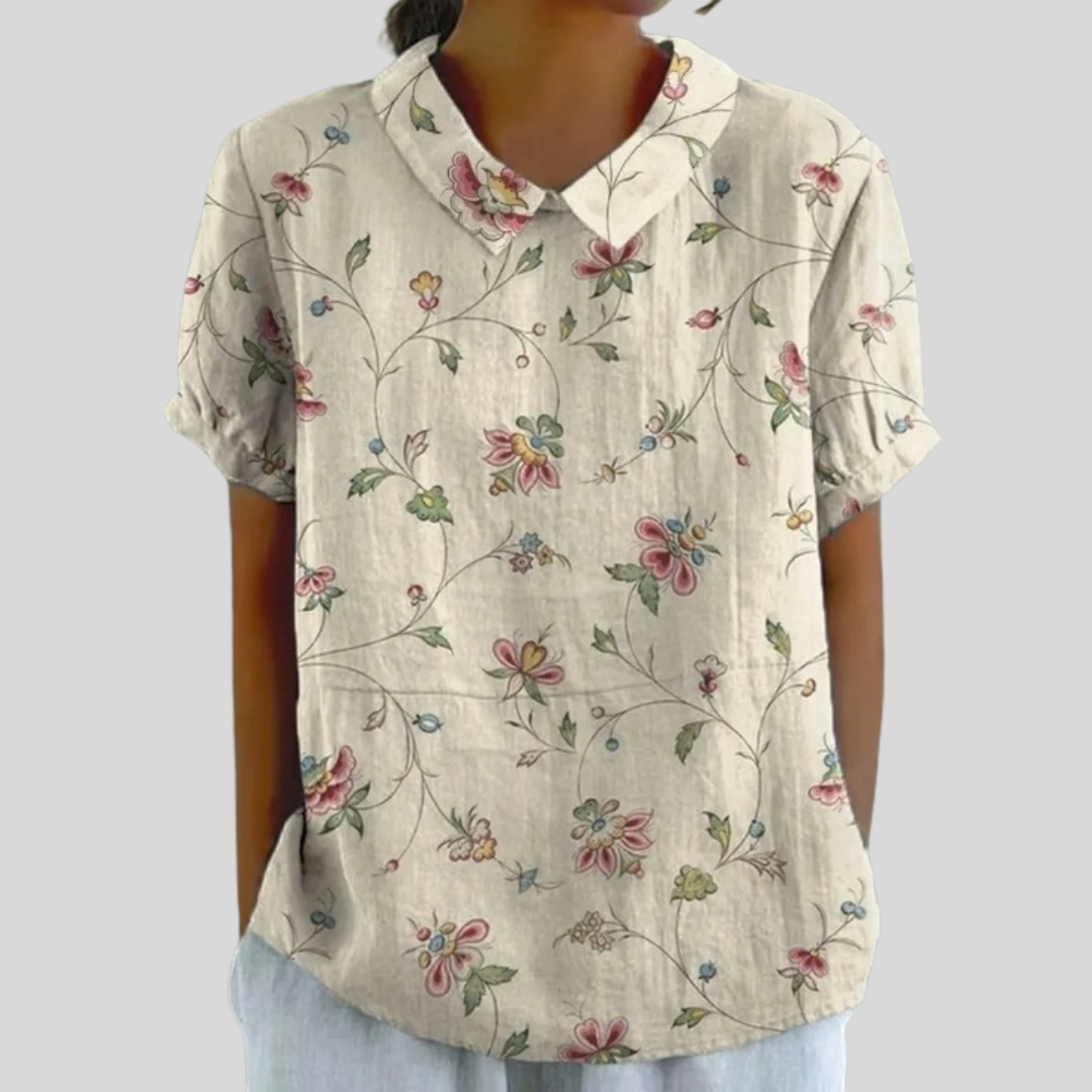 Blouse florale délicate Thérèse par Danoir Paris, tissu léger avec motifs floraux, manches longues et coupe élégante.