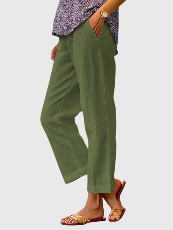 Pantalons d'été élégants pour femme Elaine™ de Danoir Paris, en tissu blanc avec coupe fluide et style sophistiqué.