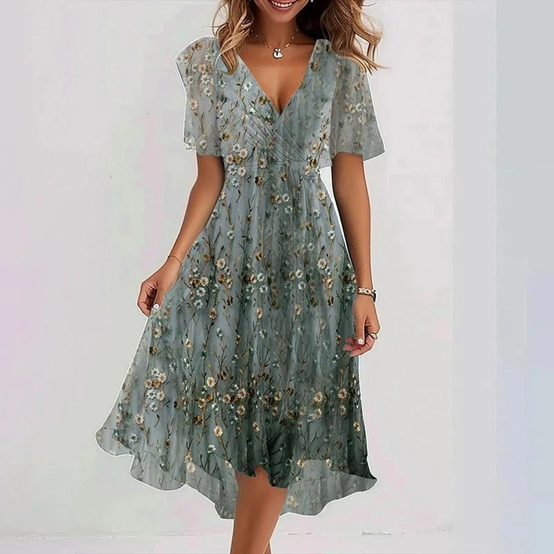 Robe florale élégante Yara de Danoir Paris en tissu vert clair, vue de face, détails de la robe et motif floral.