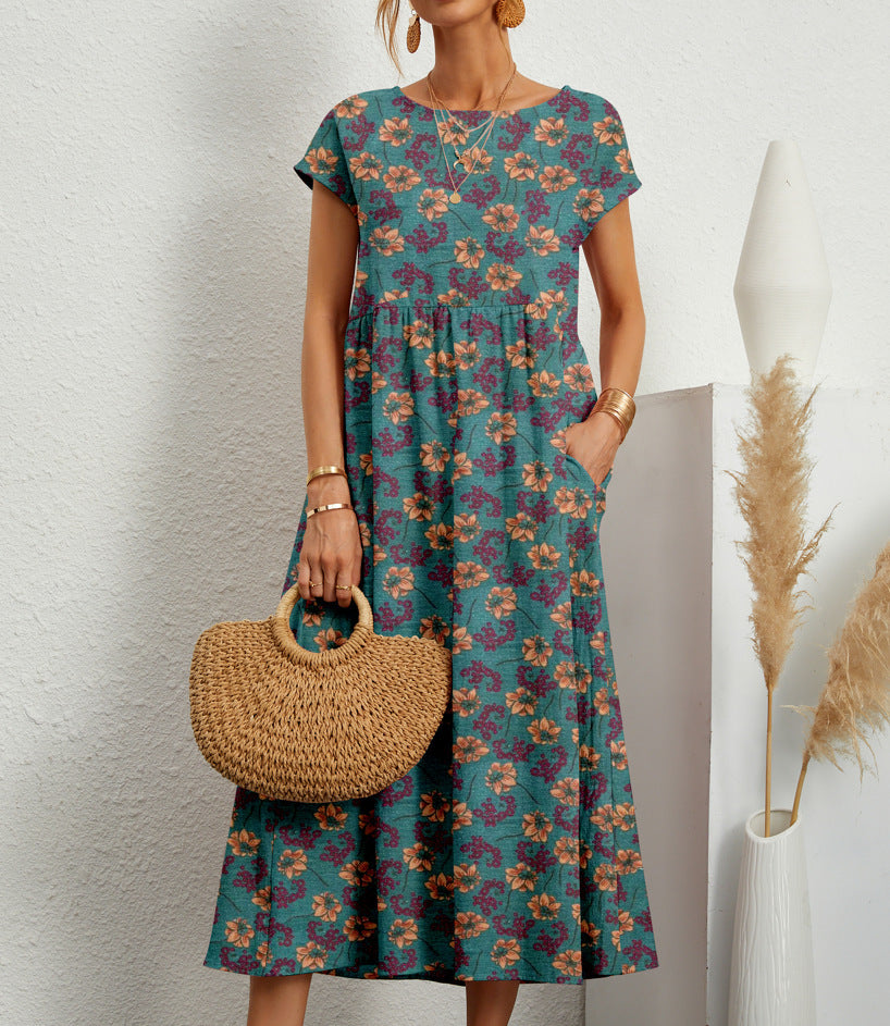 Robe florale élégante Gia de Danoir Paris en vert foncé, vue de face, tissu léger et détails de la robe.