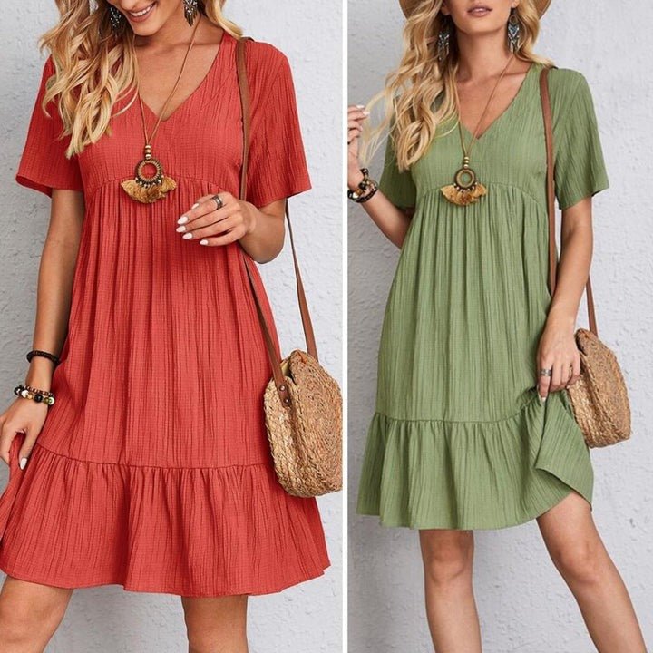 Robe élégante de couverture du ventre Aisha par Danoir Paris, tissu vert, style fluide et confortable pour femmes.