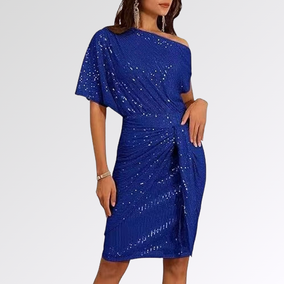 Robe asymétrique scintillante vert Danoir Paris, élégante et moderne, avec détails brillants et coupe unique.