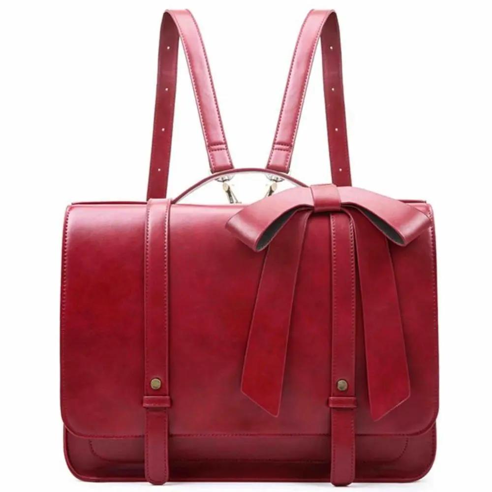 Sac rétro Knoten Twist de Danoir Paris en bleu et rose avec design vintage et détails élégants, vue de face.