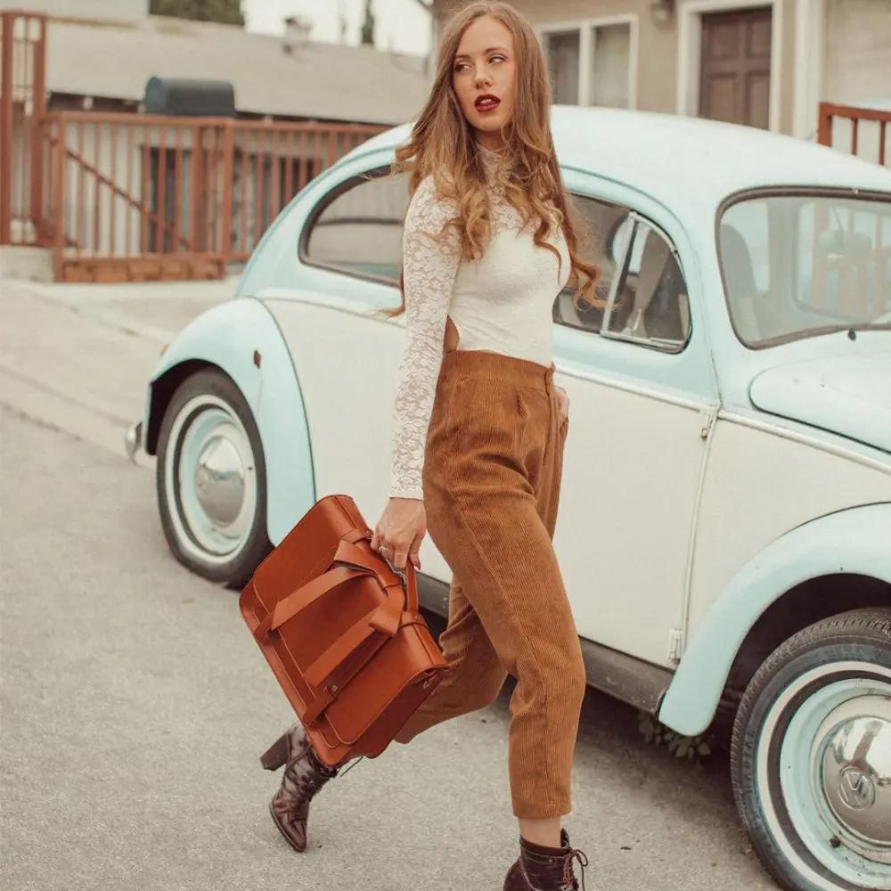 Sac rétro Knoten Twist Danoir Paris en bleu-rose avec design vintage et bandoulière élégante, vue de face sur fond neutre.
