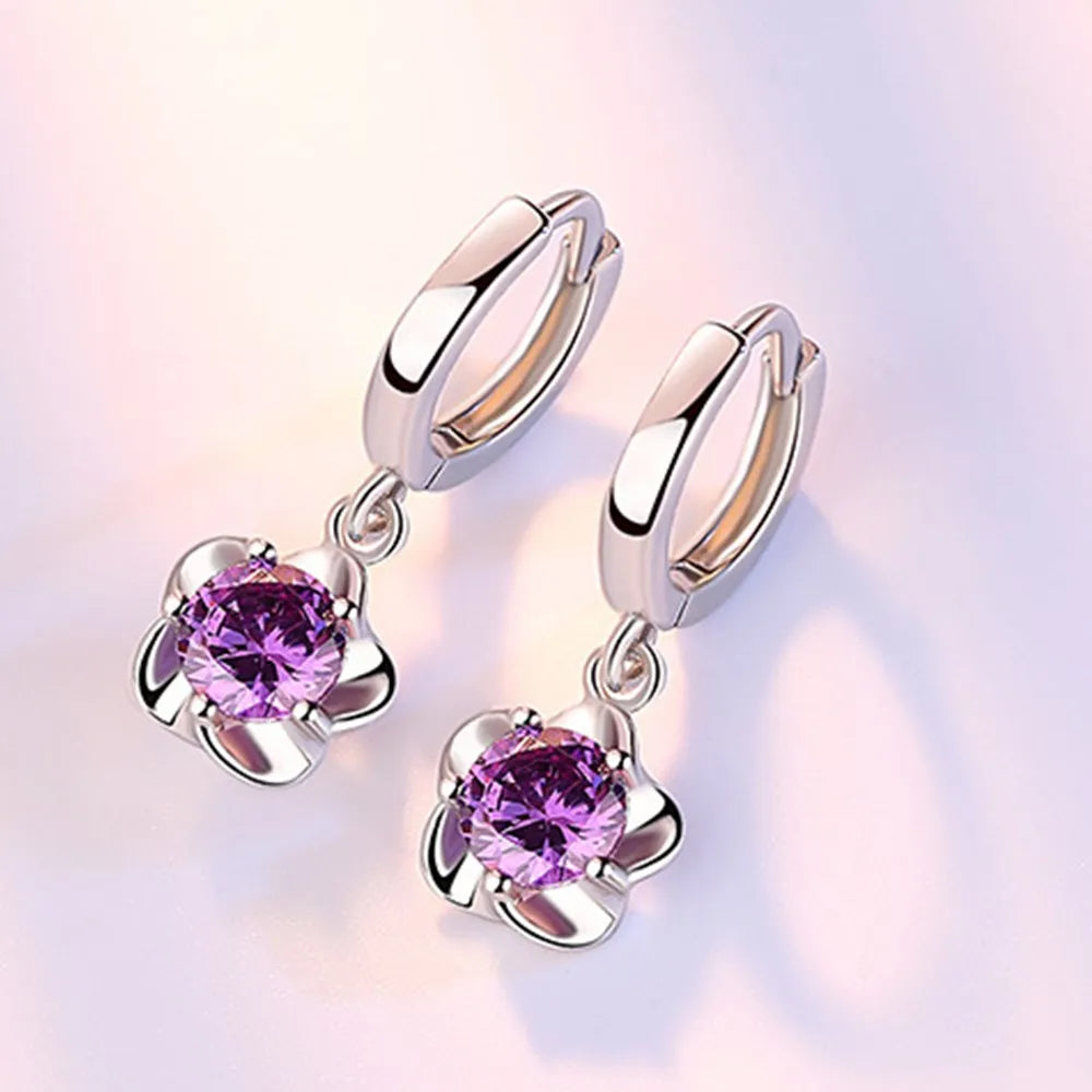 Boucles d'oreilles en Argent Sterling Danoir Paris avec zircons violets et blancs, élégantes et brillantes.