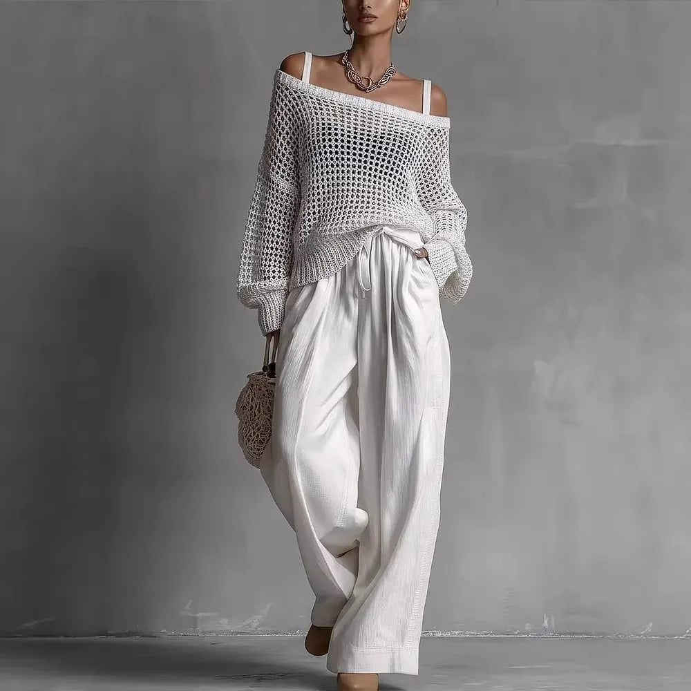 Ensemble deux pièces élégant Claribel™ de Danoir Paris en blanc, avec haut et pantalon sophistiqués, porté sur un mannequin.