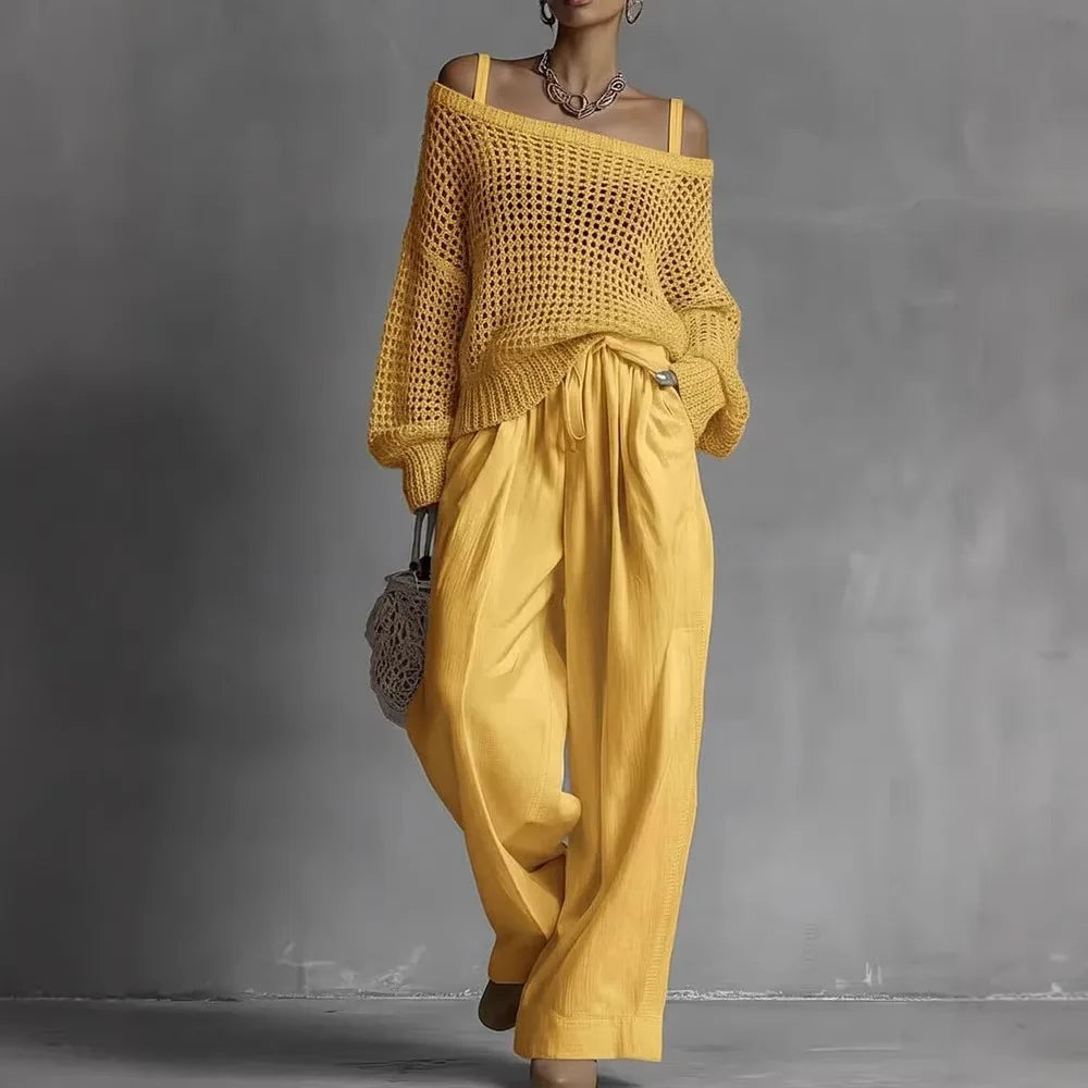 Ensemble deux pièces Claribel™ élégant de Danoir Paris, en blanc, avec haut et pantalon sophistiqués, porté sur mannequin.