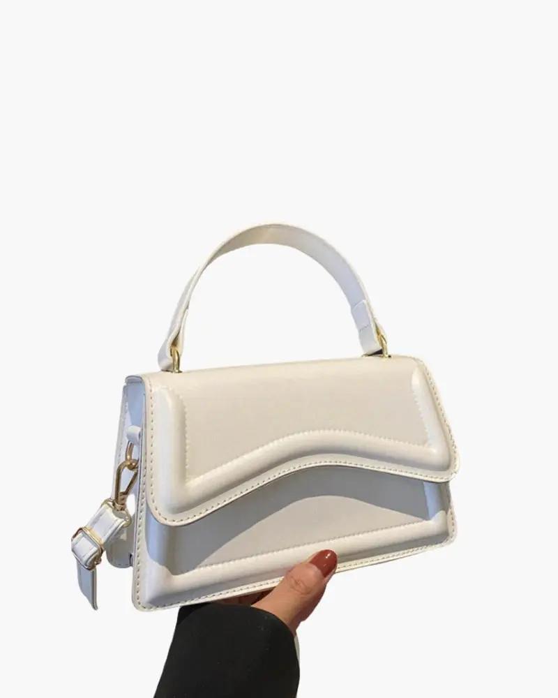 Sac à main blanc Danoir Paris Ibiza, en cuir élégant avec poignées et détails sophistiqués, vu de face.