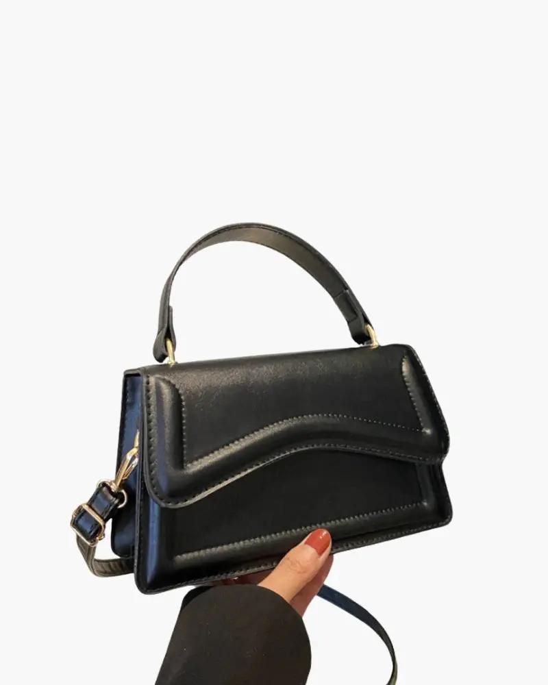 Sac à main blanc Danoir Paris Ibiza, en cuir, avec poignées courtes et design élégant visible sur l’image.