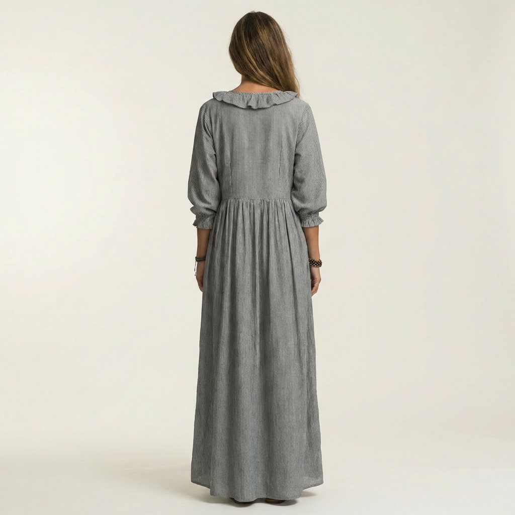 Robe maxi rayée Danoir Paris avec volants et décolleté en V, longueur fluide et style élégant pour l'été.