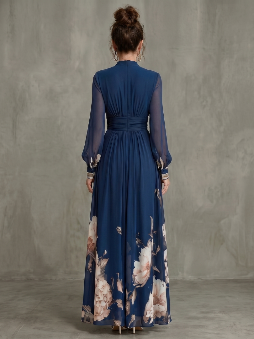 Robe maxi Danoir Paris à manches transparentes et ourlet floral, détails élégants, tissu fluide et design féminin.