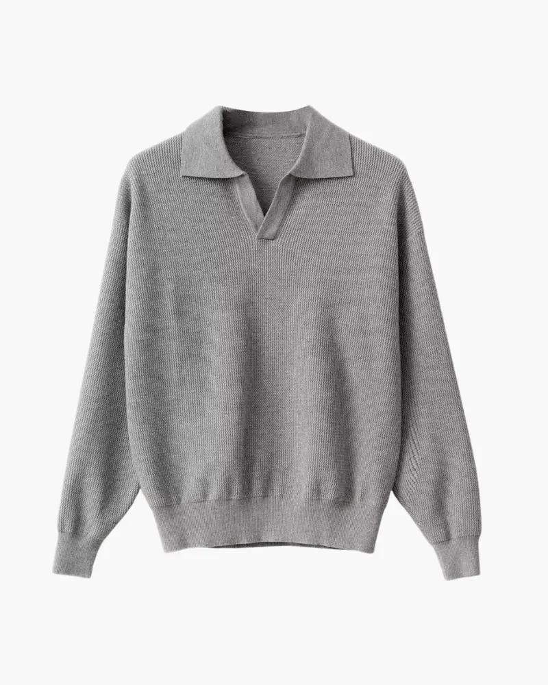 Pull à col polo en maille texturée noir de la marque Old Money, détail en tricot avec texture visible.