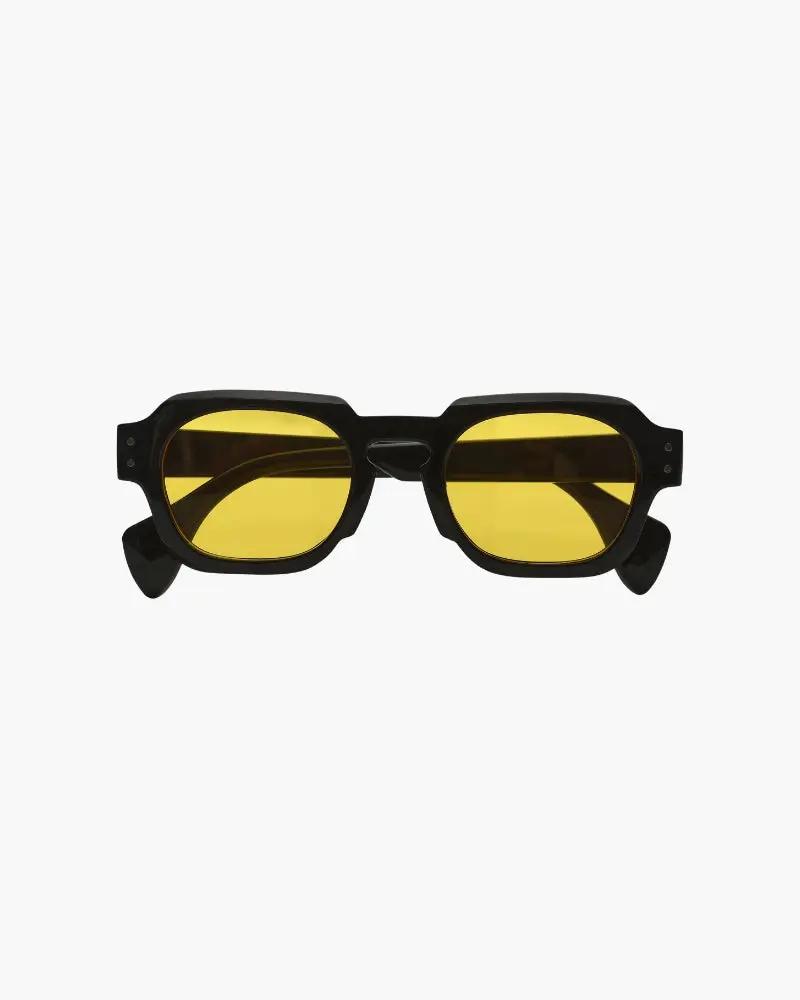 Lunettes de soleil Monaco Old Money avec monture bleue, verres foncés et design élégant, vue de face.