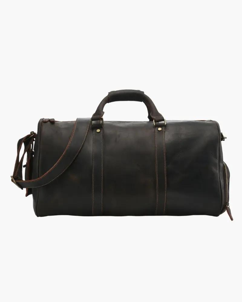 Sac de voyage en cuir Montague de la marque Old Money, en brun avec poignées et fermeture en métal visible.