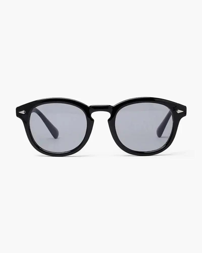 Lunettes teintées Old Money transparentes avec monture en acétate, style vintage et design élégant.